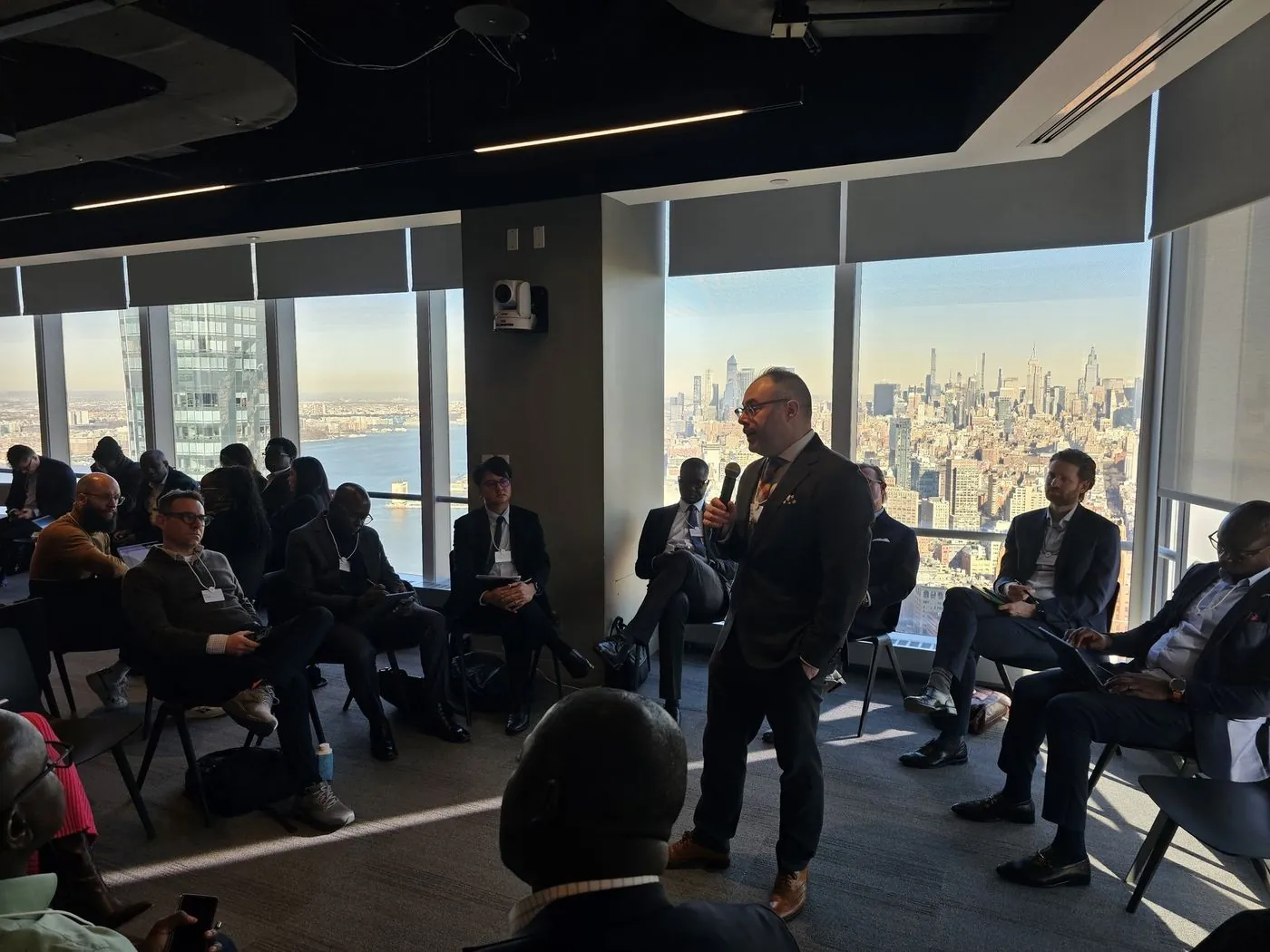 SupTech Week 2025 in New York: a session in the round, Manhattan skyline behind
